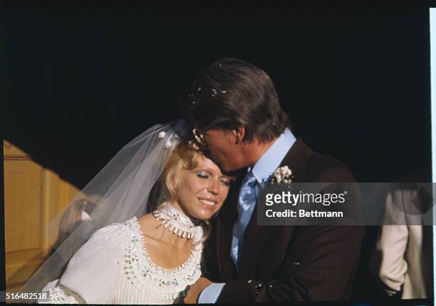 Cathedral City, CA: Nancy Sinatra and her new husband, producer choreographer Hugh Lambert, pose for photographers as they leave St. Louis Catholic...