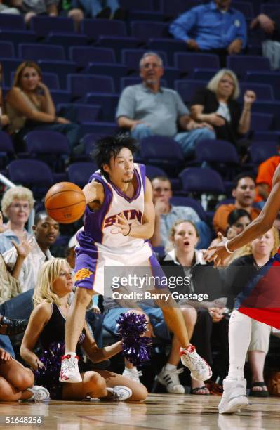 Yuta Tabuse of the Phoenix Suns makes a pass against the Los Angeles Clippers on October 13, 2004 at America West Arena in Phoenix, Arizona. The Suns...