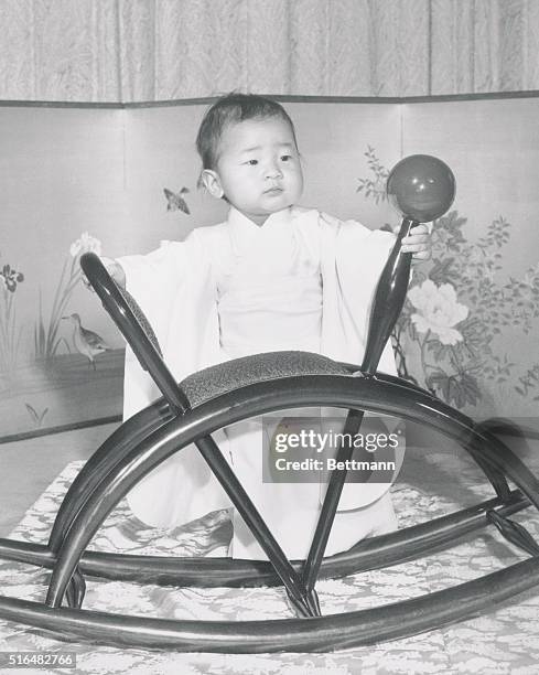 Royal Happy Birthday. Tokyo, Japan: Princess Nori, daughter of Crown Prince Akihito and Princess Michico, plays with a wooden horse at Togu Palace....