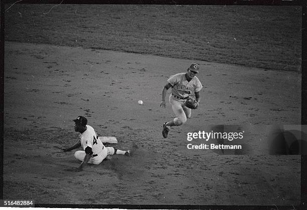 Red's short stop Dave Concepcion takes a flying leap in the air to field a ground ball hit by Braves Rico Carty in the seventh inning. Concepcion...