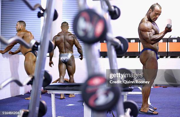 Athletes warm up back stage before the Arnold Classic Mens Bodybuilding Open during the 2016 Arnold Classic on March 19, 2016 in Melbourne, Australia.