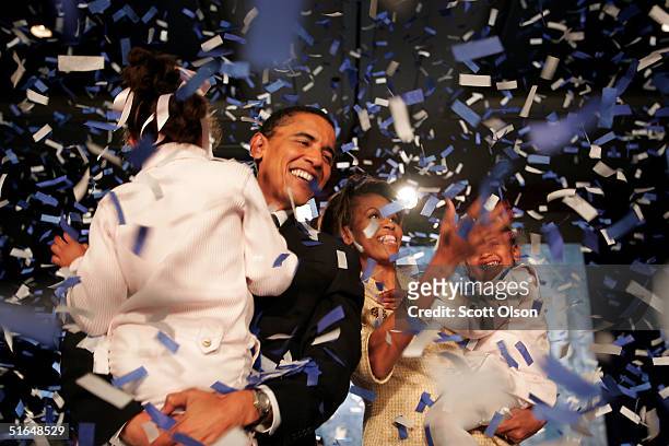 Candidate for the U.S. Senate Barack Obama and his daughter Malia , wife Michelle and youngest daughter Sasha celebrate his victory with supporters...
