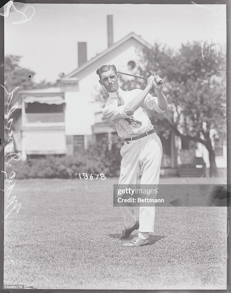 L.M. MacDonald Swinging His Golf Club