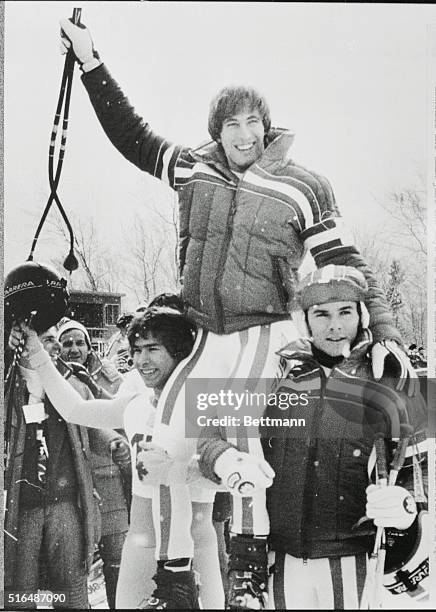 Lake Placid, N.Y.: Austrian gold medal winner Leonhard Stock gets a victory ride on the shoulders of teammate Peter Wirnsberger , who took the silver...