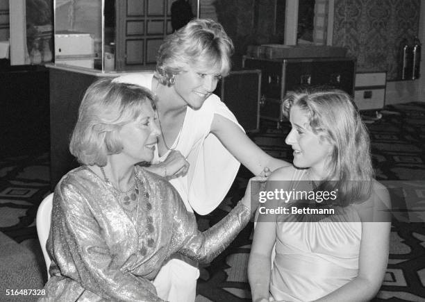 Young tennis star Tracy Austin chats with Dinah Shore and Donna de Varona, swimming headliner, at the inaugural Women's Sports Foundation awards...