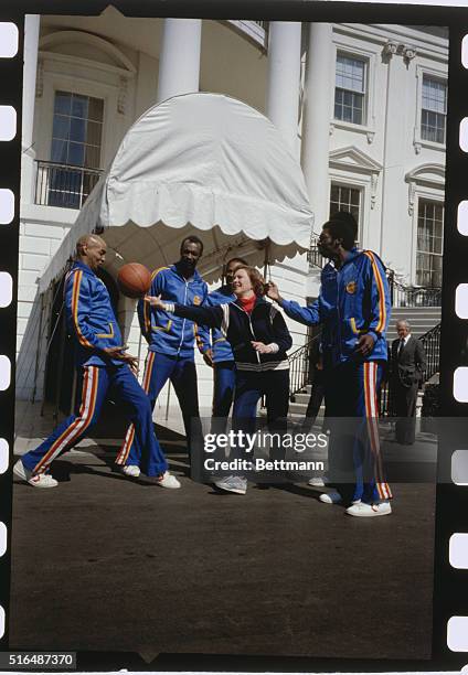 First Lady Rosalynn Carter lets one get away as she tried to balance a basketball on her fingertips during a photo session with the world famous...