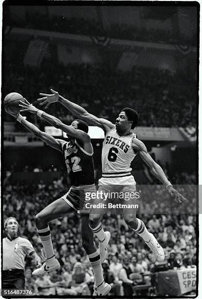 Lakers' Jamaal Wilkes scores past the long reach of Sixers' Julius Erving in the third quarter of their championship game at the Spectrum in...