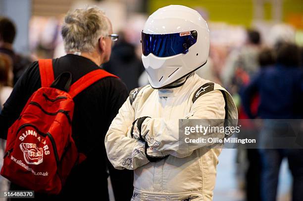 An attendee at Comic Con 2016 in cosplay as The Stig on March 19, 2016 in Birmingham, United Kingdom.