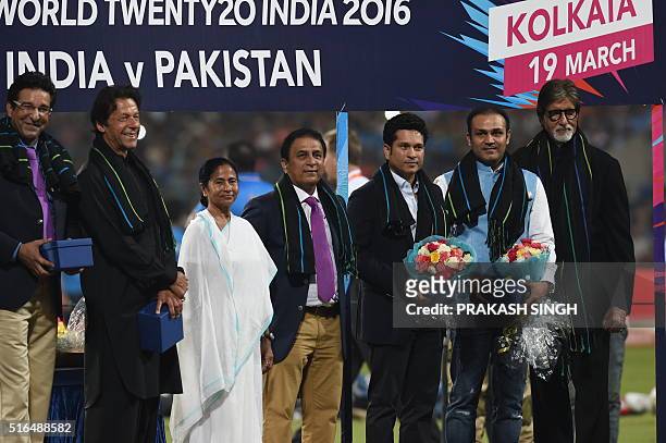Former Pakistan cricketers Wasim Akramand Imran Khan pose with Chief Minister of the Indian state of West Bengal Mamata Bannerjeeand former Indian...