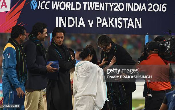 Former Pakistan cricketers Imran Khan,Wasim Akramand current Pakistan coach Waqar Younislook on as Indian Bollywood actor Amitabh Bachchanis...