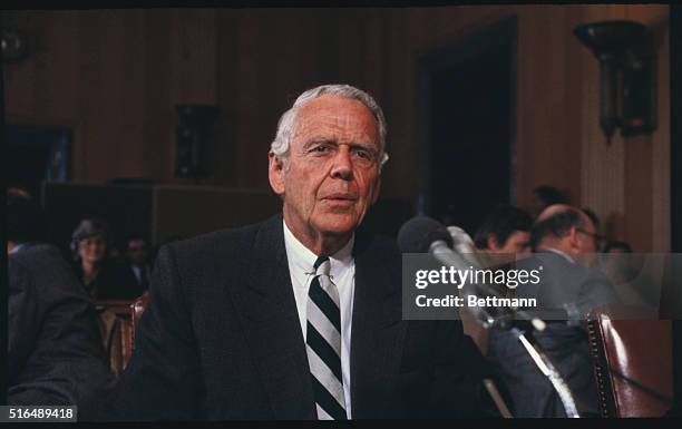 Washington: Clark Gifford, President Carter's special emissary on southwest Asia, adjusts his glasses during an appearance 3/18, before the Senate...