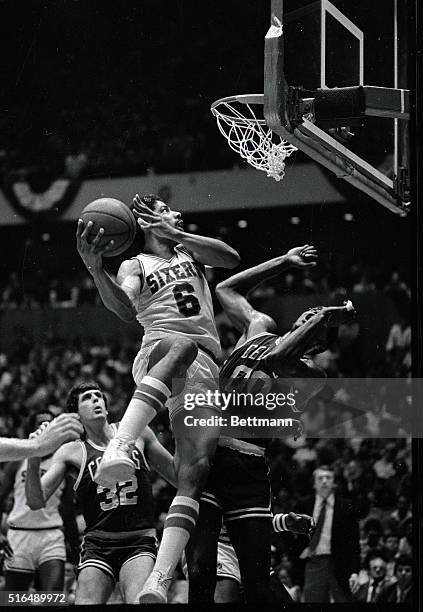 Sixers' Julius Erving slams into Celtics' Robert Parrish as he scored in he second quarter in Philadelphia 5/16.