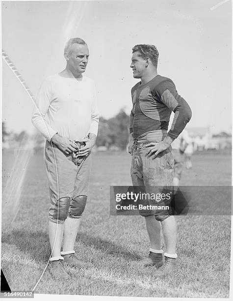 Brown University Gridders Practice. Head Coach D.C. "Tuss" McLaughry and Captain F.J. Gilbane of the Brown University football team, are seen here...