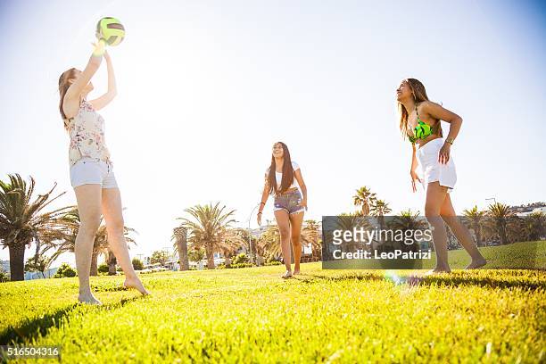women playing volley at park - hot filipina women stock pictures, royalty-free photos & images