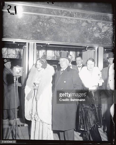 Titian-naired Hope Hampton and her husband, Jules Brulator, seen as they arrived for the opening of the Radio City Music hall in New York on December...