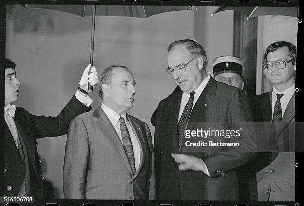 Paris, France: West German chancellor Helmut Kohl is greeted by President Francois Mitterrand as he arrives at Elysee Palace for talks and dinner.
