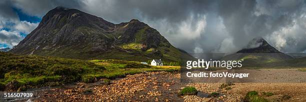 mountain cottage below dramatic wilderness peaks panorama glencoe highlands scotland - scotland stock pictures, royalty-free photos & images