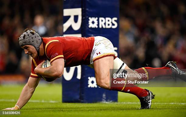 Jonathan Davies of Wales goes over to score his team's third try during the RBS Six Nations match between Wales and Italy at the Principality Stadium...