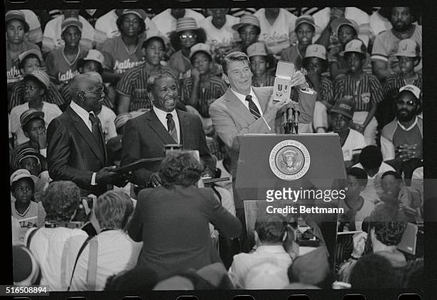 St. Louis: President Ronald Reagan presented founders of the Mathews-Dickey Boys' Club, Hubert Dickey Ballantine and Martin Mathews the presidential...