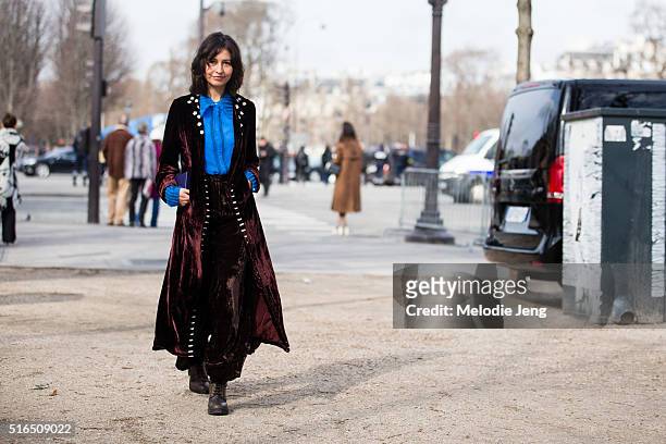 Wara Juana Gutierrez Mamani, Jupe by Jackie designer, wears an auburn color silk pajama-style outfit with a detailed blue top after the Chanel show...