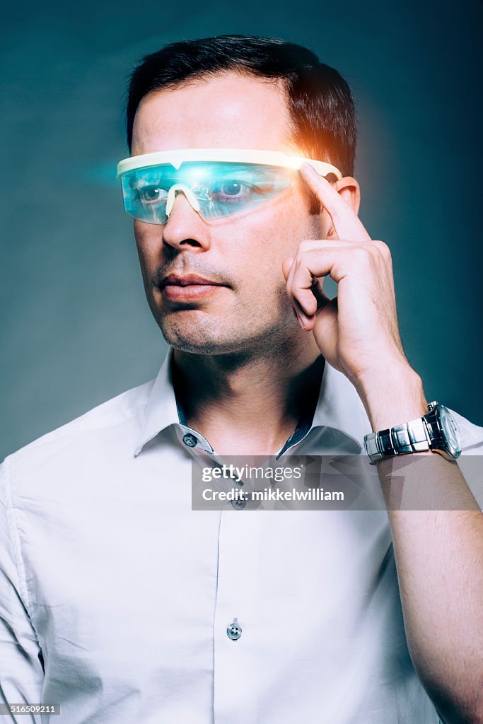 Man wears technology glasses with a visual screen