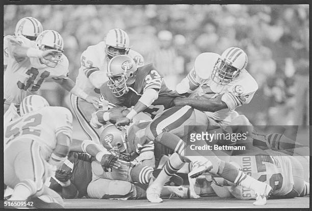 Houston: Houston's right defensive-end Jesse Baker grabs a hold of San Francisco's fullback Roger Craig by the waist, stopping him from gaining any...