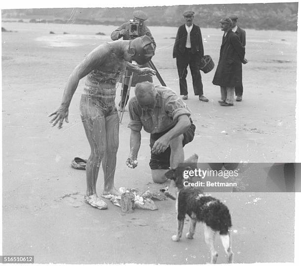 Gertrude Ederle being greased for her channel swim.