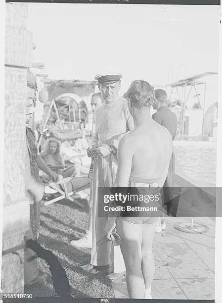 Enjoying California's Warm Christmas Sun. Paul Lukas speaking to Zeppo Marx at El Mirador Hotel, Palm Springs, Calif., where members of the Hollywood...