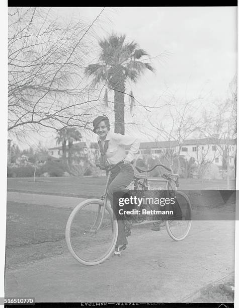 But Where's Hubby? Nancy Carroll, winsome screen star, intended going for a bicycle ride with hubby Bolto Mallory, but he didn't show up so Nancy...