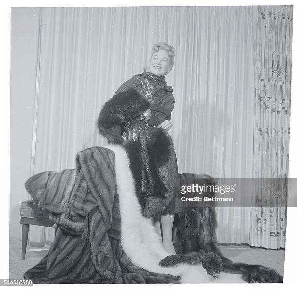 Las Vegas: Dorothy Kristen, opera singer displays seven valuable and lavish fur wraps she wears during her night club act at the Tropicana Hotel, Las...