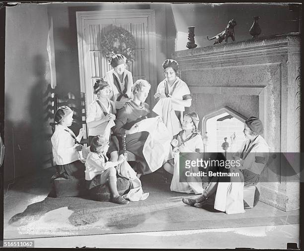 Roosevelt Daughter Teaches Camp Fire Girls How To Sew. Mrs. Curtis Dall, daughter of President elect Roosevelt, who with her mother, edits the Baby's...
