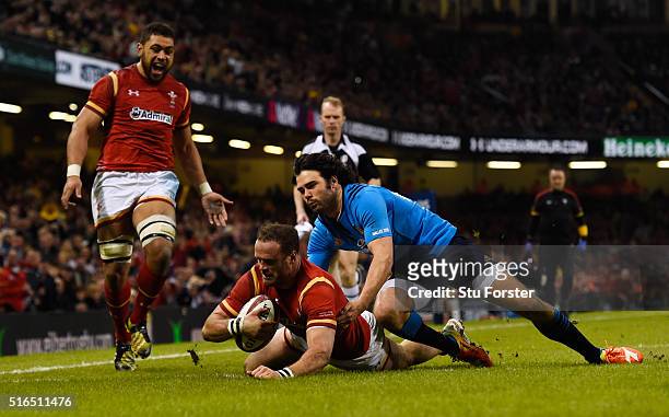 Jamie Roberts of Wales goes past Luke McLean of Italy to score his team's fourth try during the RBS Six Nations match between Wales and Italy at the...