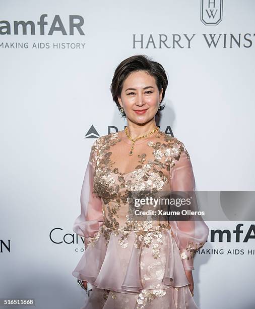 Pansy Ho attends the 2016 amfAR Hong Kong gala with a guest at Shaw Studios on March 19, 2016 in Hong Kong, Hong Kong.