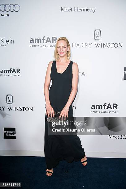 Uma Thurman attends the 2016 amfAR Hong Kong gala with a guest at Shaw Studios on March 19, 2016 in Hong Kong, Hong Kong.