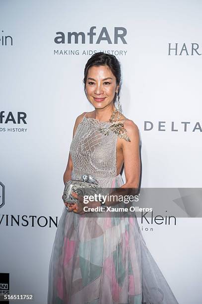 Michelle Yeoh attends the 2016 amfAR Hong Kong gala with a guest at Shaw Studios on March 19, 2016 in Hong Kong, Hong Kong.