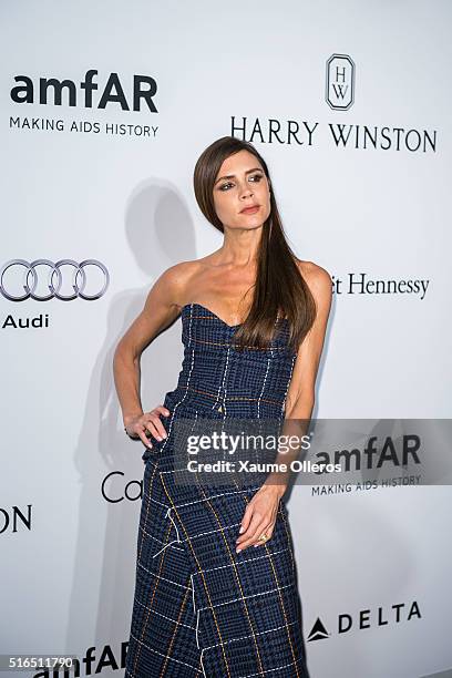 Victoria Beckham attends the 2016 amfAR Hong Kong gala with a guest at Shaw Studios on March 19, 2016 in Hong Kong, Hong Kong.