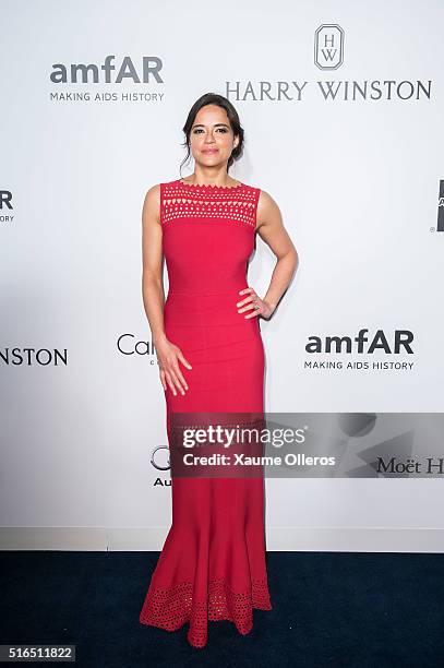 Michelle Rodriguez attends the 2016 amfAR Hong Kong gala with a guest at Shaw Studios on March 19, 2016 in Hong Kong, Hong Kong.