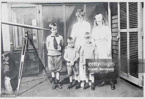 Mrs.Franklin D. Roosevelt with four of her children on veranda of their summer cottage on 11 mile long Canadian Island of Campobello, New Brunswick,...