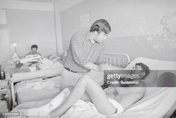 San Salvador, El Salvador. Representative Bill Richardson, Democrat-NM, 3/29 visits a wounded soldier recuperating from injuries received in combat...