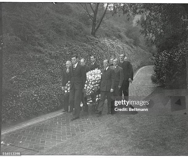 The casket containing the body of Jack Pickford, screen actor who died in Paris a few weeks ago, is taken from the wee Kirk'O'The Heather after...