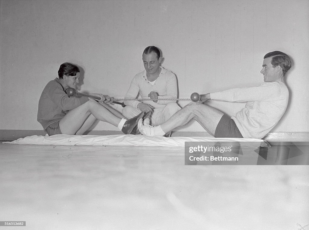 Mildred Didrickson with Johnny Farrell Using Exercise Apparatus