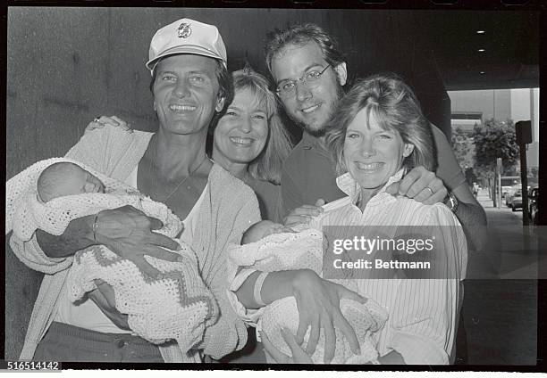 Singer Debbie Boone leaves Cedars-Sinai Hospital here 9/21 with her new twin daughters. Left to right are grandfather pat Boone holding twin Dustin,...