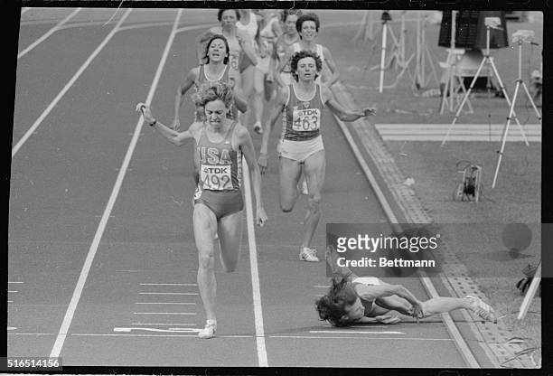 American Mary Decker steps on the finish line to score a gold medal double at the World Track and Field Championships, winning a dramatic 1,500...