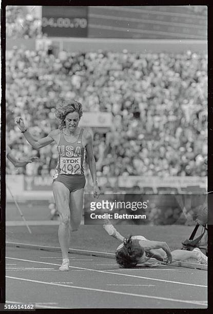 American Mary Decker steps on the finish line to score a gold medal double at the World Track and Field Championships, winning a dramatic 1,500...