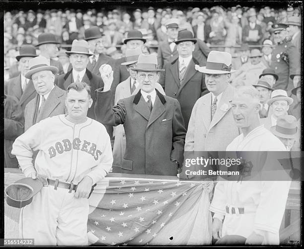 Mayor J. Hampton Moore of Philadelphia, throws out the first ball to officially open the 1933 baseball season at Baker Field, Philadelphia, as the...