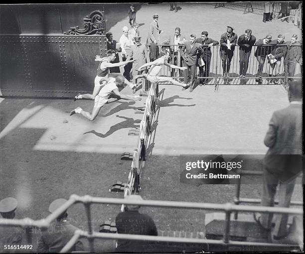 Penn Relay Games at Franklin Field, Philadelphia. The above photo shows Beatty of Michigan Normal, as he won the 1st heat of the 400 metre hurdles at...