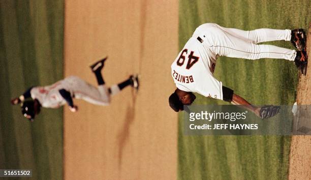 Baltimore Orioles relief pitcher Armando Benitez bends over after giving up the game-winning home run in the 11th inning to Tony Fernandez 15 October...