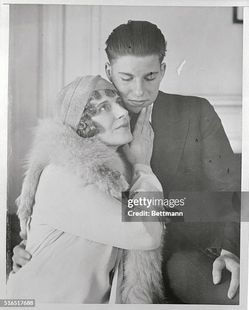 Aimee Semple McPherson, noted woman evangelist, arrived in New York City to board the S.S. Aquitaria for Europe, where she will lecture on her...