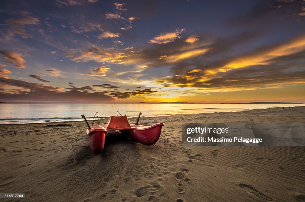 Sunset with red boat