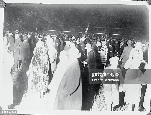 Part of the immense crowd of 30,000 people which gathered around the "Spirt of St. Louis" after Captain Charles Lindbergh, daring American aviator,...